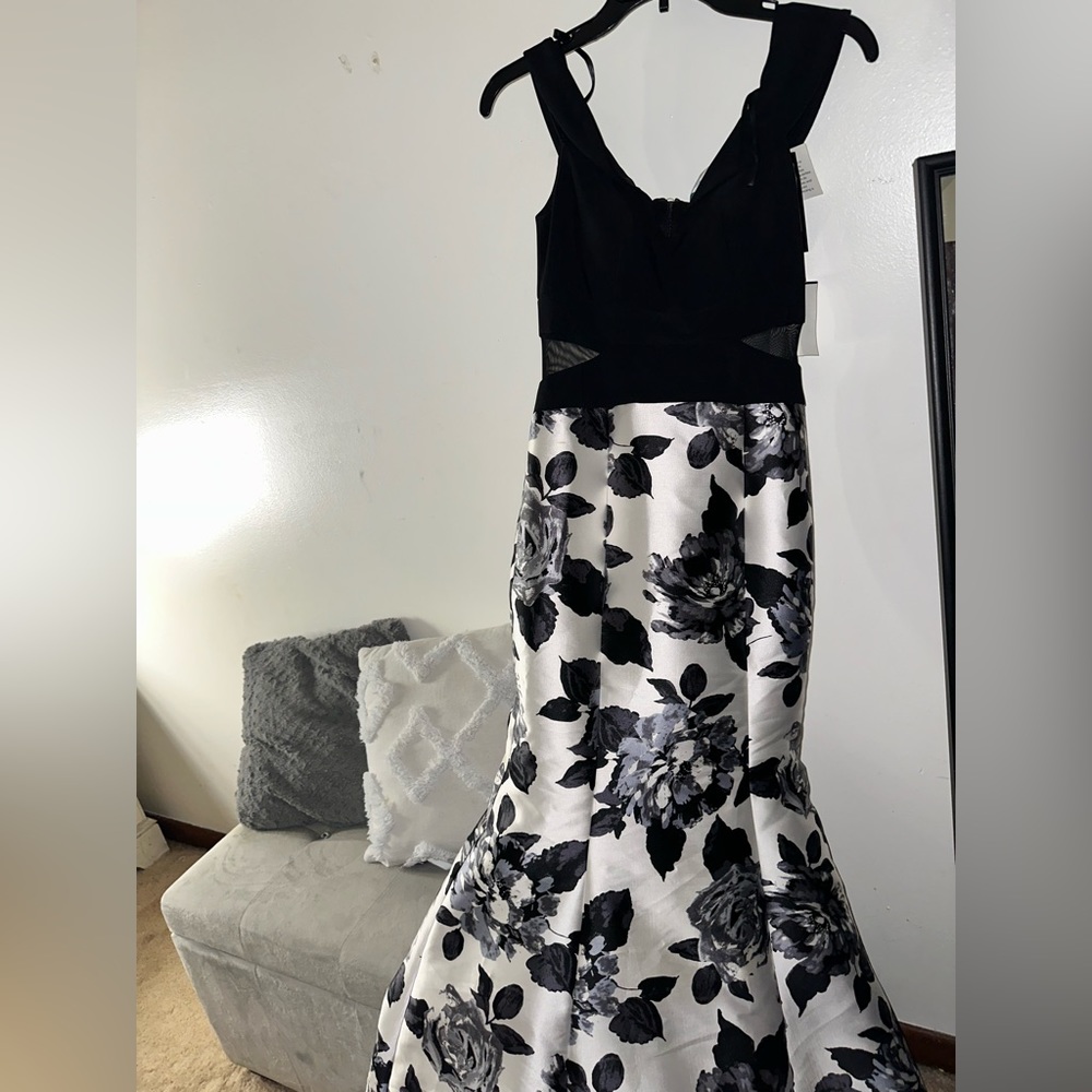 Long black and white never worn before Camille La Vie prom dress in the size 4.